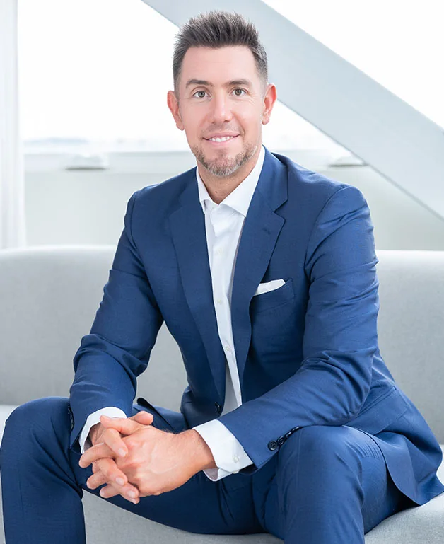 Jeremy Bruce, Principal Broker, in navy suit